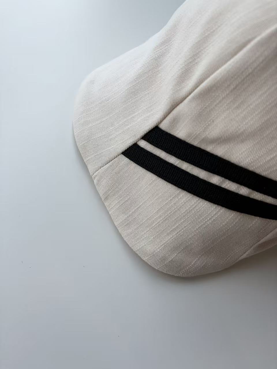 White Baseball Cap with Black Side Stripes